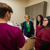 Congresswoman Lee in hospital room with health care workers