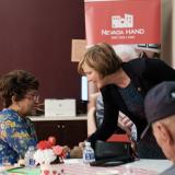 Congresswoman Lee shaking hands with constituent