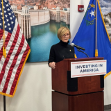 Congresswoman Lee speaks at podium