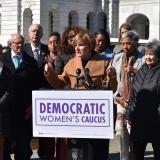 Congresswoman Lee speaking at podium