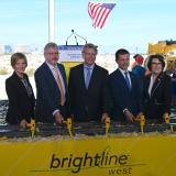 Congresswoman Lee and attendees hammer nails at groundbreaking