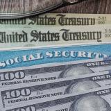 Fake Social security card on prop US currency and treasury department checks
