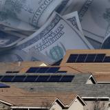 Image of neighborhood street with dollar bills in background