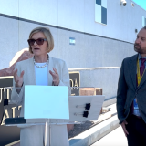 Rep. Susie Lee and Randy Smith speak during a news conference