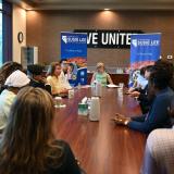 Rep. Lee and attendees speak at a roundtable