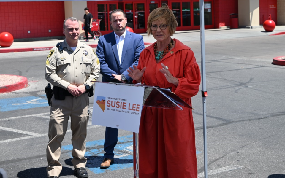 Congresswoman Lee speaking alongside law enforcement in front of Target