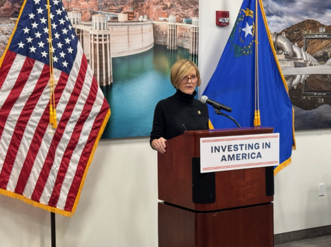 Congresswoman Lee speaks at podium