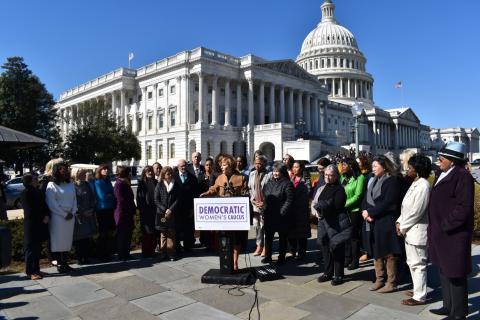 Congresswoman Lee speaking at podium