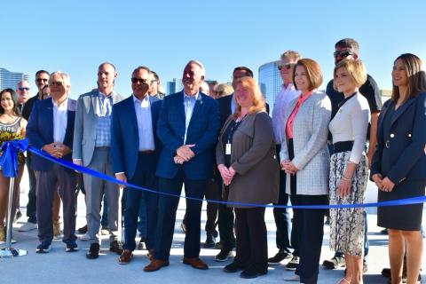Rep. Susie Lee and speakers cut ribbon