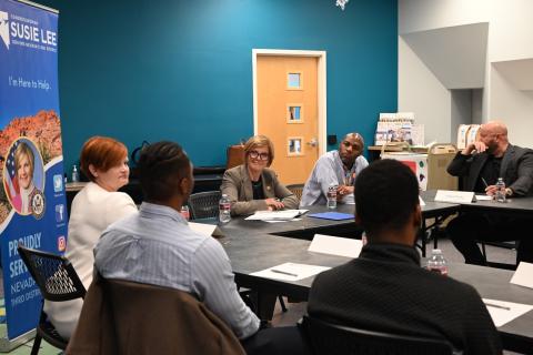 Congresswoman Lee sitting at roundtable