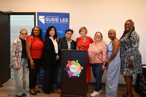 Congresswoman Lee at podium with attendees