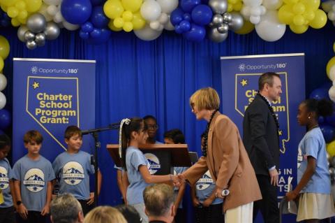 Rep. Lee shakes hands with student