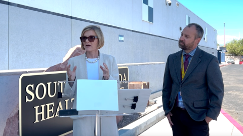 Rep. Susie Lee and Randy Smith speak during a news conference