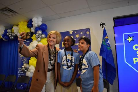 Rep. Susie Lee takes a selfie with two students